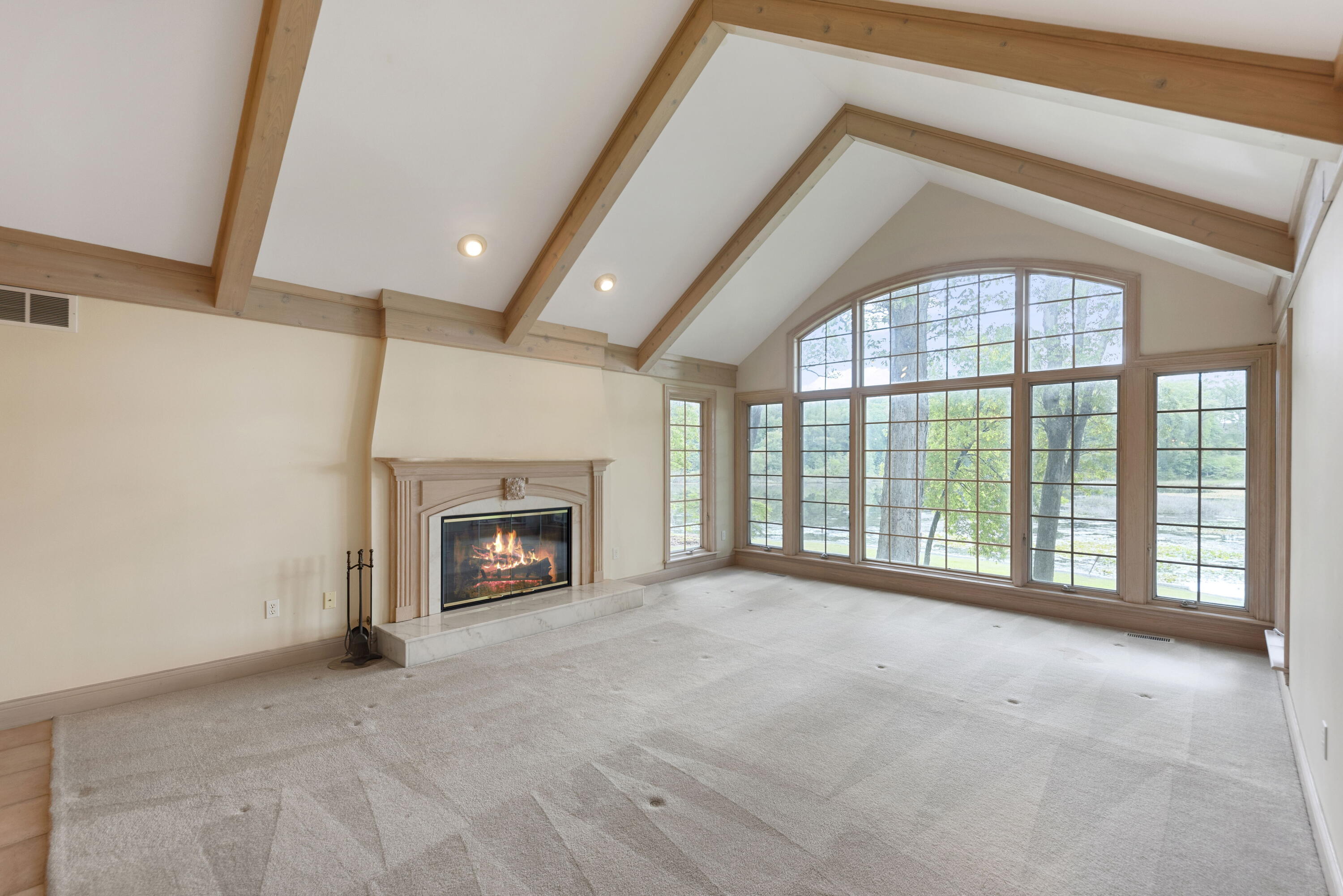3611 West Waverly Road La Porte, IN 46350 - Photo 7 of 40 a view of an empty room with a fireplace and a window
