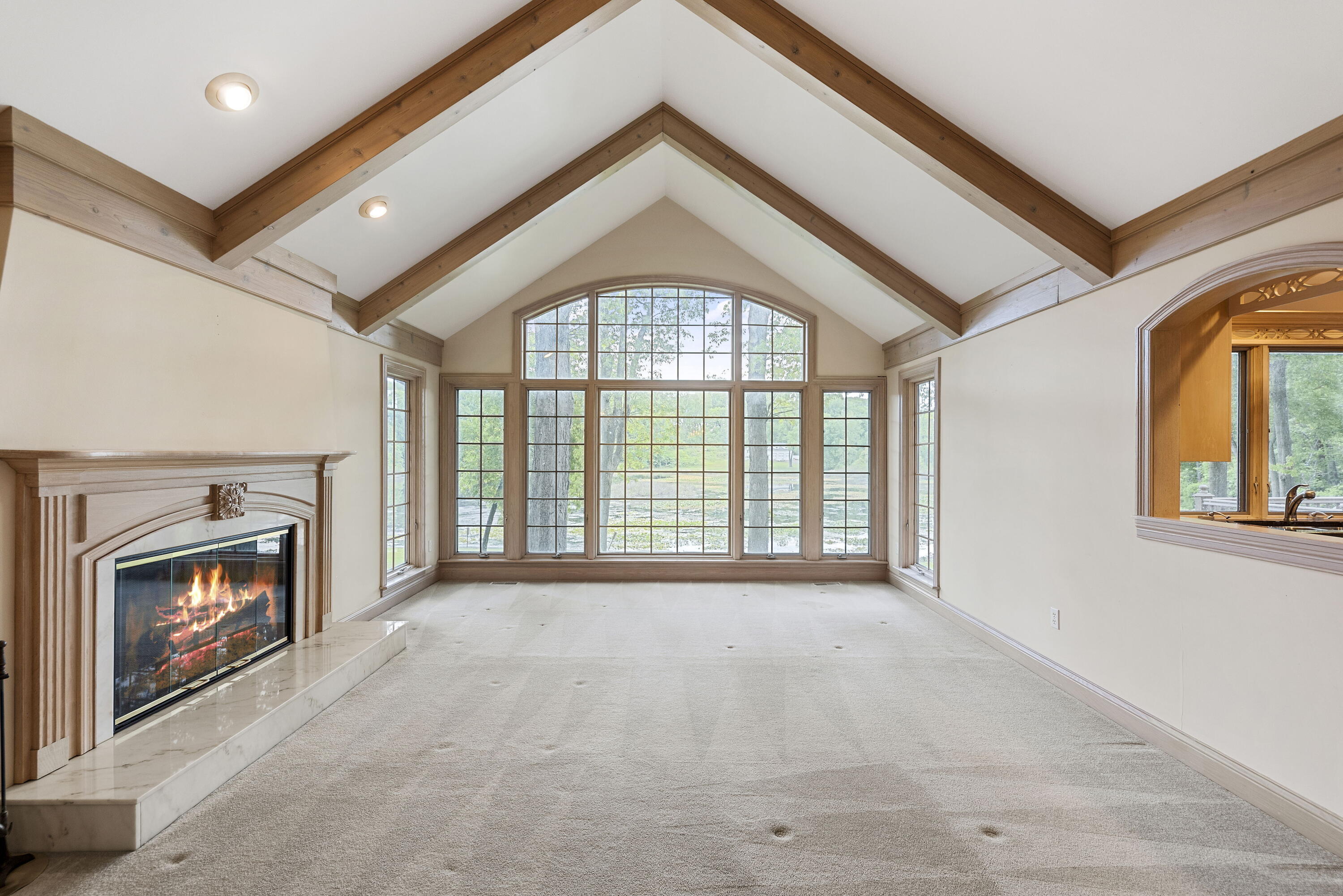 3611 West Waverly Road La Porte, IN 46350 - Photo 9 of 40 a view of an empty room with a fireplace and a window