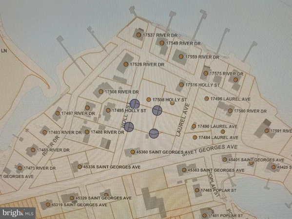 a large white bed sitting next to a white wall