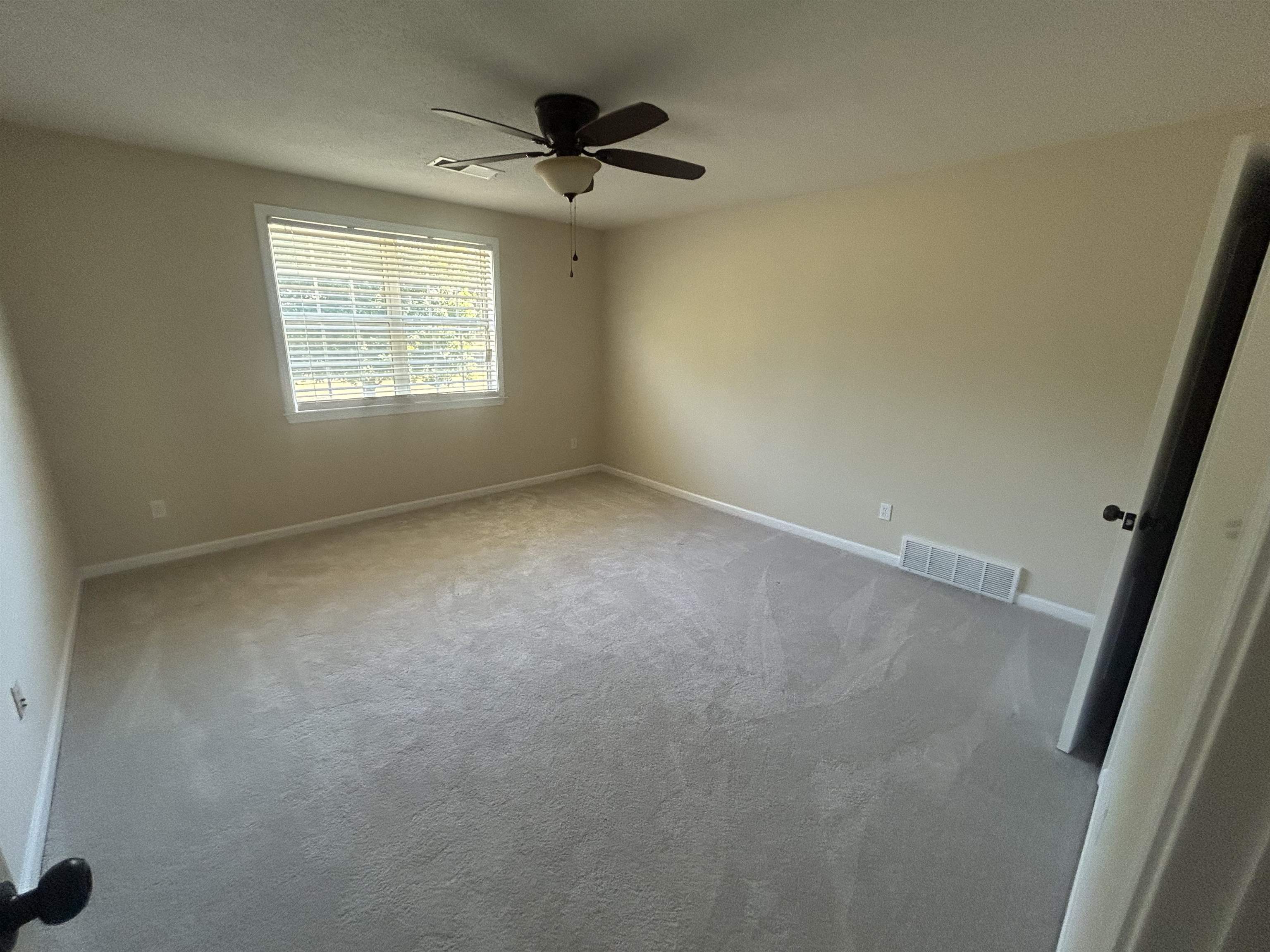 9958 Idaville Road Atoka, TN 38004 - Photo 17 of 20 Unfurnished room featuring carpet and ceiling fan