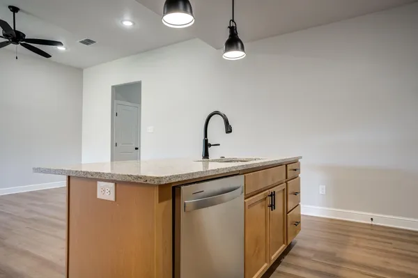 a kitchen with a sink and a refrigerator