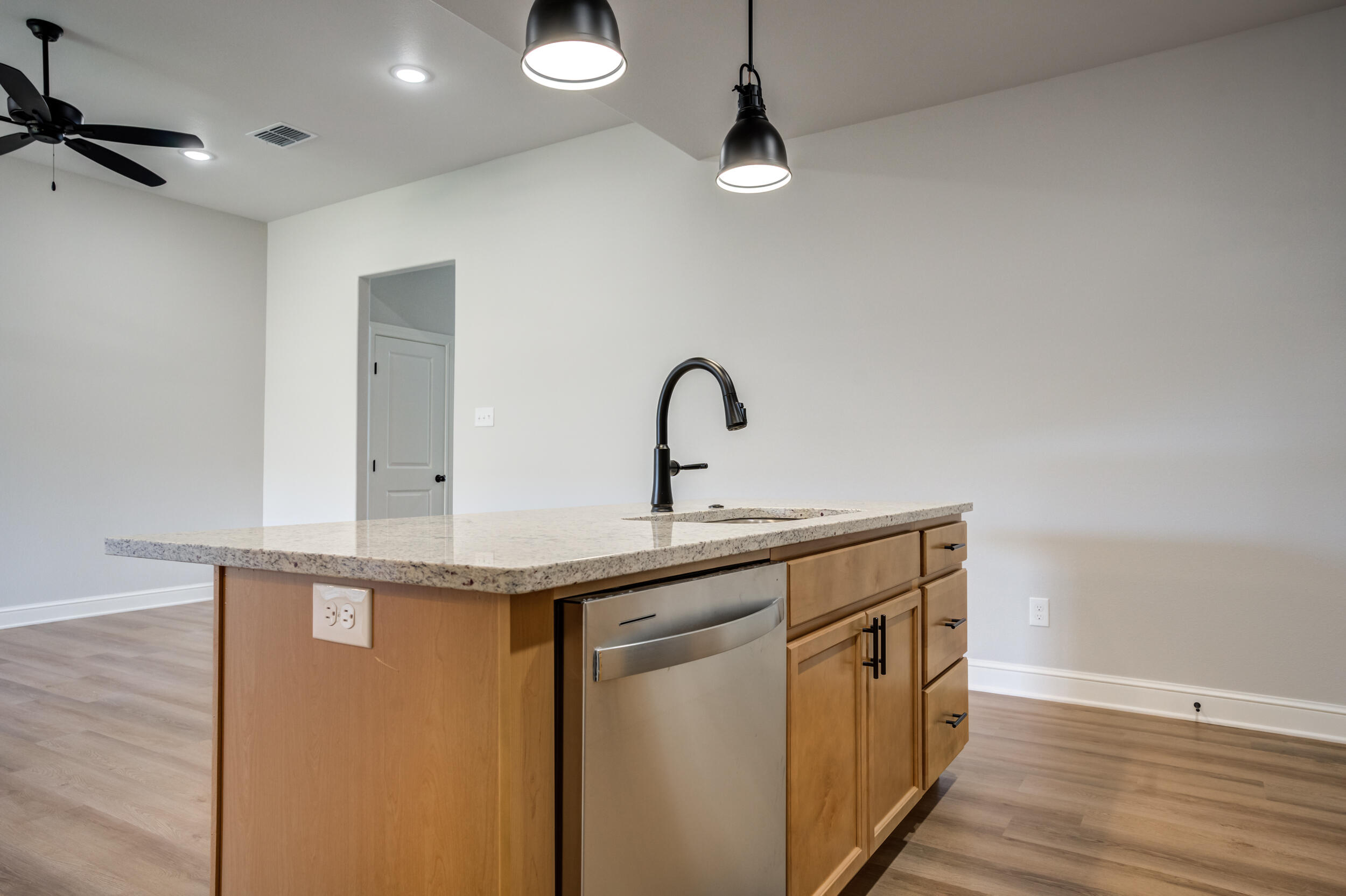 2534 137th Street Lubbock, TX 79423 - Photo 17 of 46 a kitchen with a sink and a refrigerator