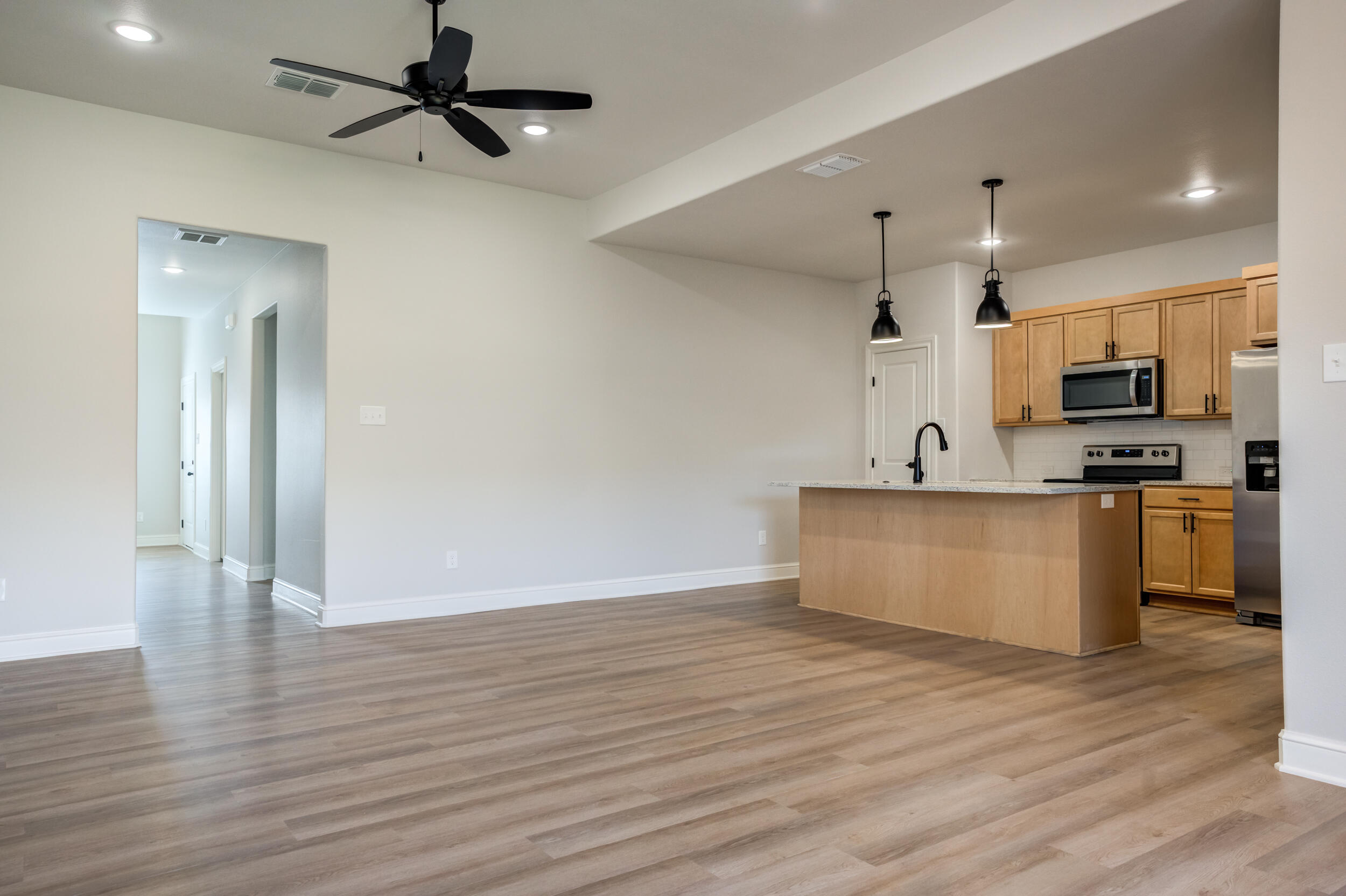 2534 137th Street Lubbock, TX 79423 - Photo 23 of 46 a view of kitchen with microwave and cabinets