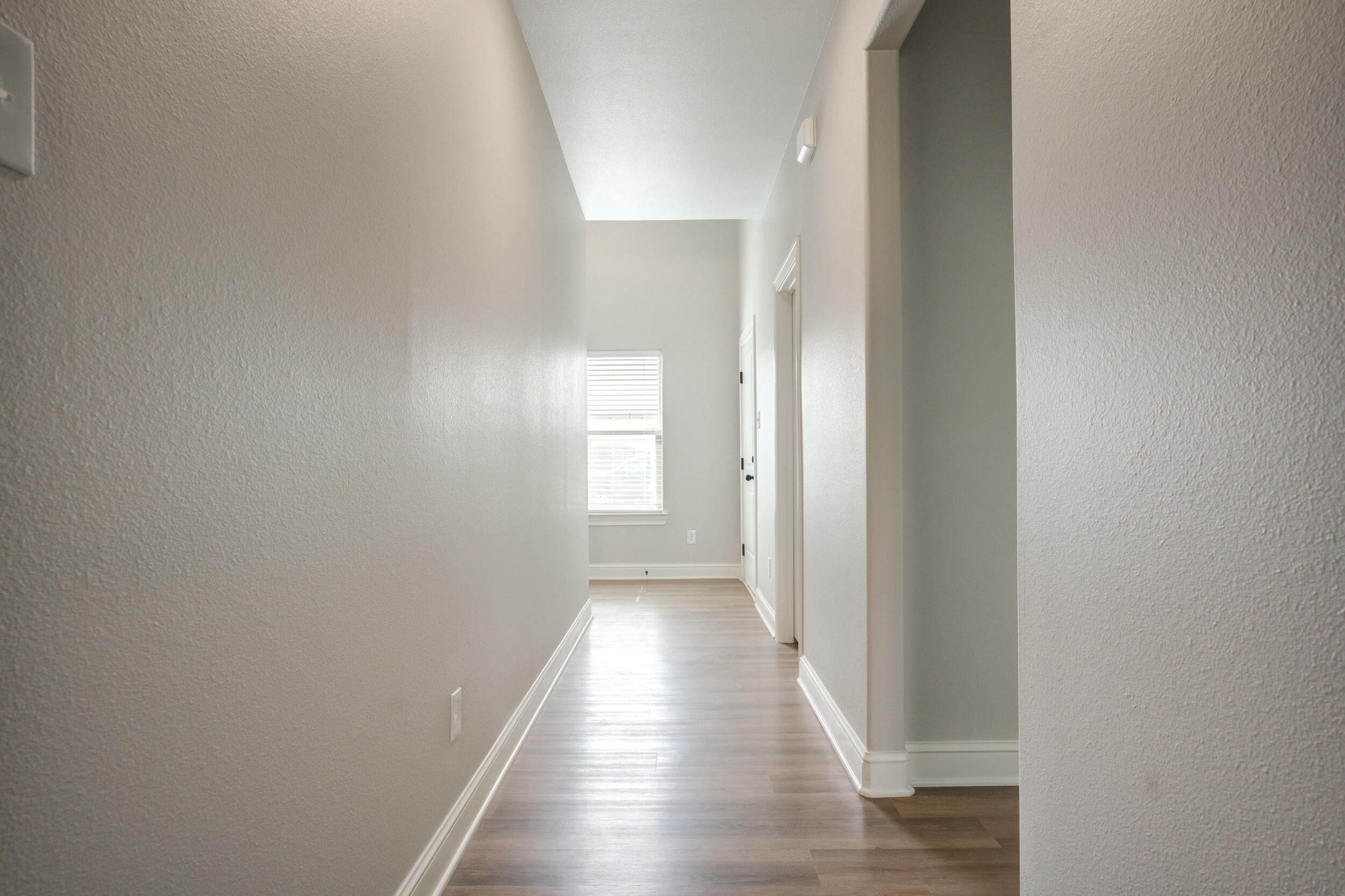 2534 137th Street Lubbock, TX 79423 - Photo 25 of 46 a view of a hallway with wooden floor