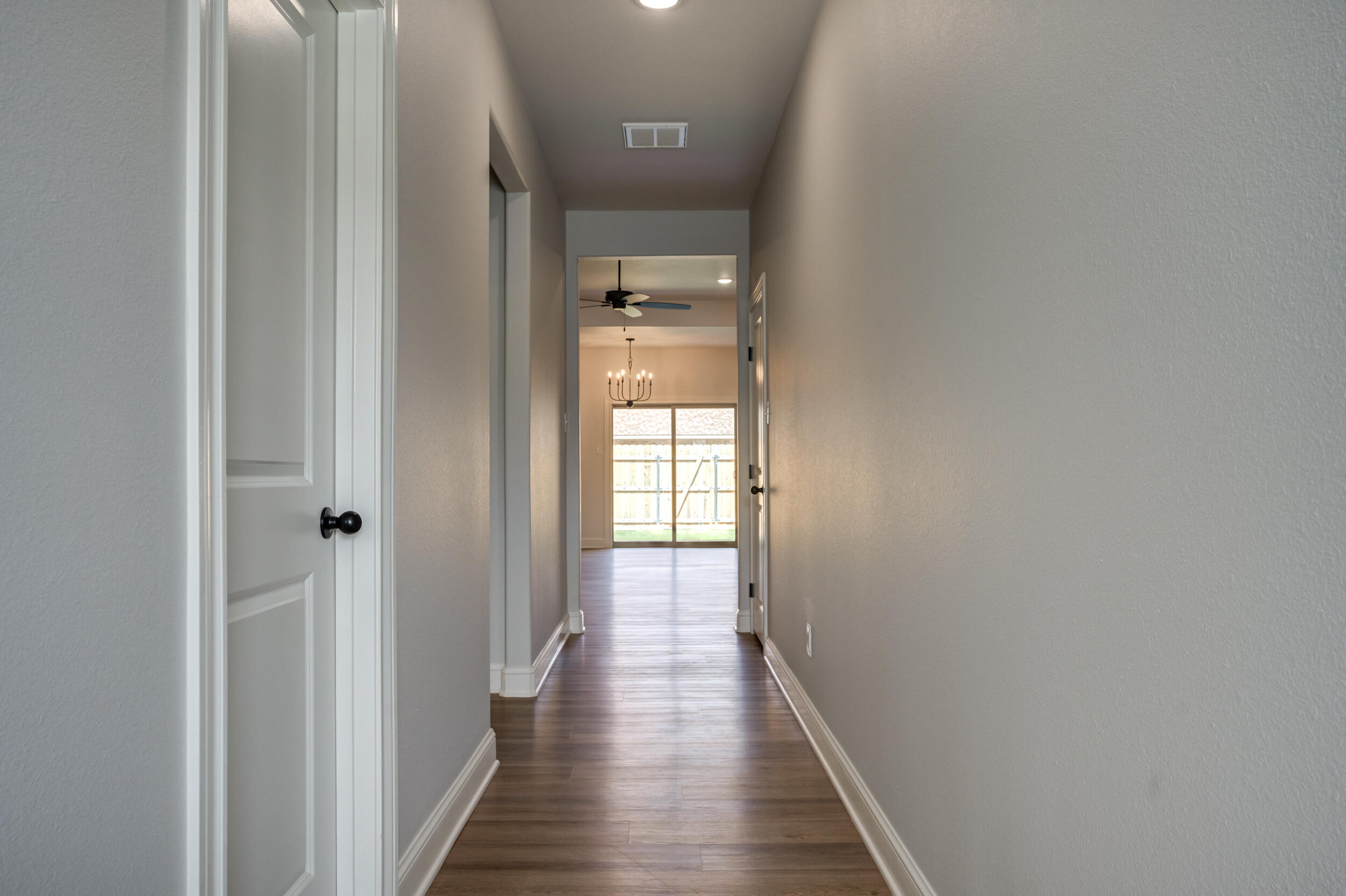 2534 137th Street Lubbock, TX 79423 - Photo 32 of 46 a view of a hallway with wooden floor