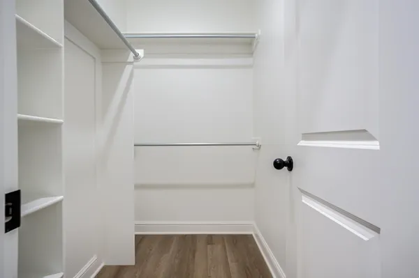 a view of an empty walk in closet