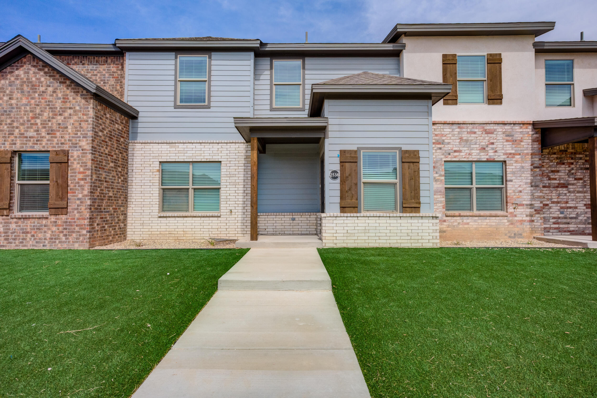 2534 137th Street Lubbock, TX 79423 - Photo 6 of 46 a front view of a house with a yard