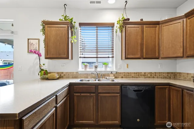 a kitchen with a sink and a cabinets