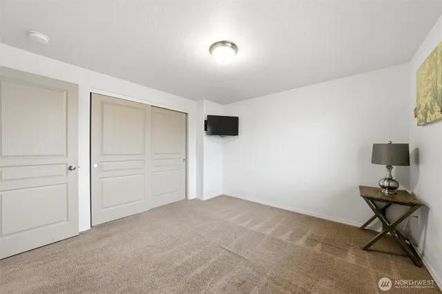 a view of room with air conditioner and windows