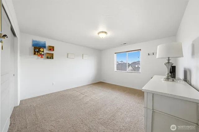 a workspace with furniture and a window