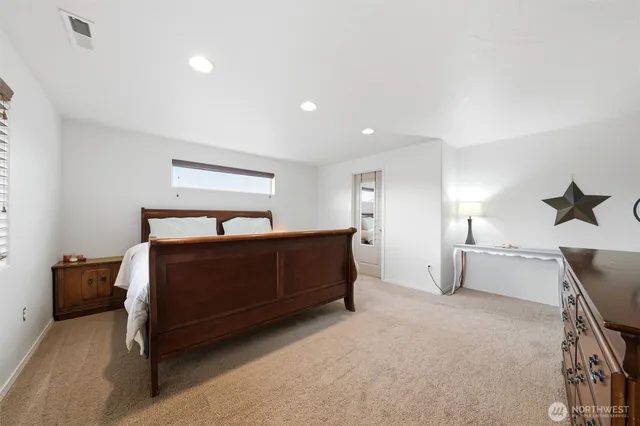 a bedroom with a bed and window