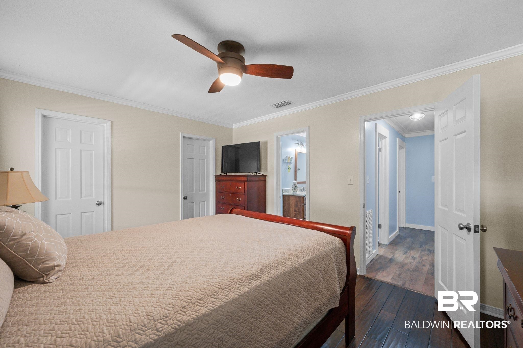 20037 County Road 33 Fairhope, AL 36532 - Photo 30 of 79 Bedroom with ornamental molding, ensuite bathroom, dark wood-type flooring, and ceiling fan
