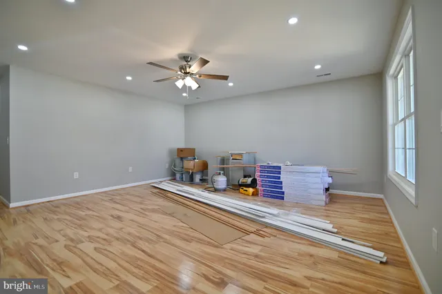 a view of a kitchen with a sink and a refrigerator