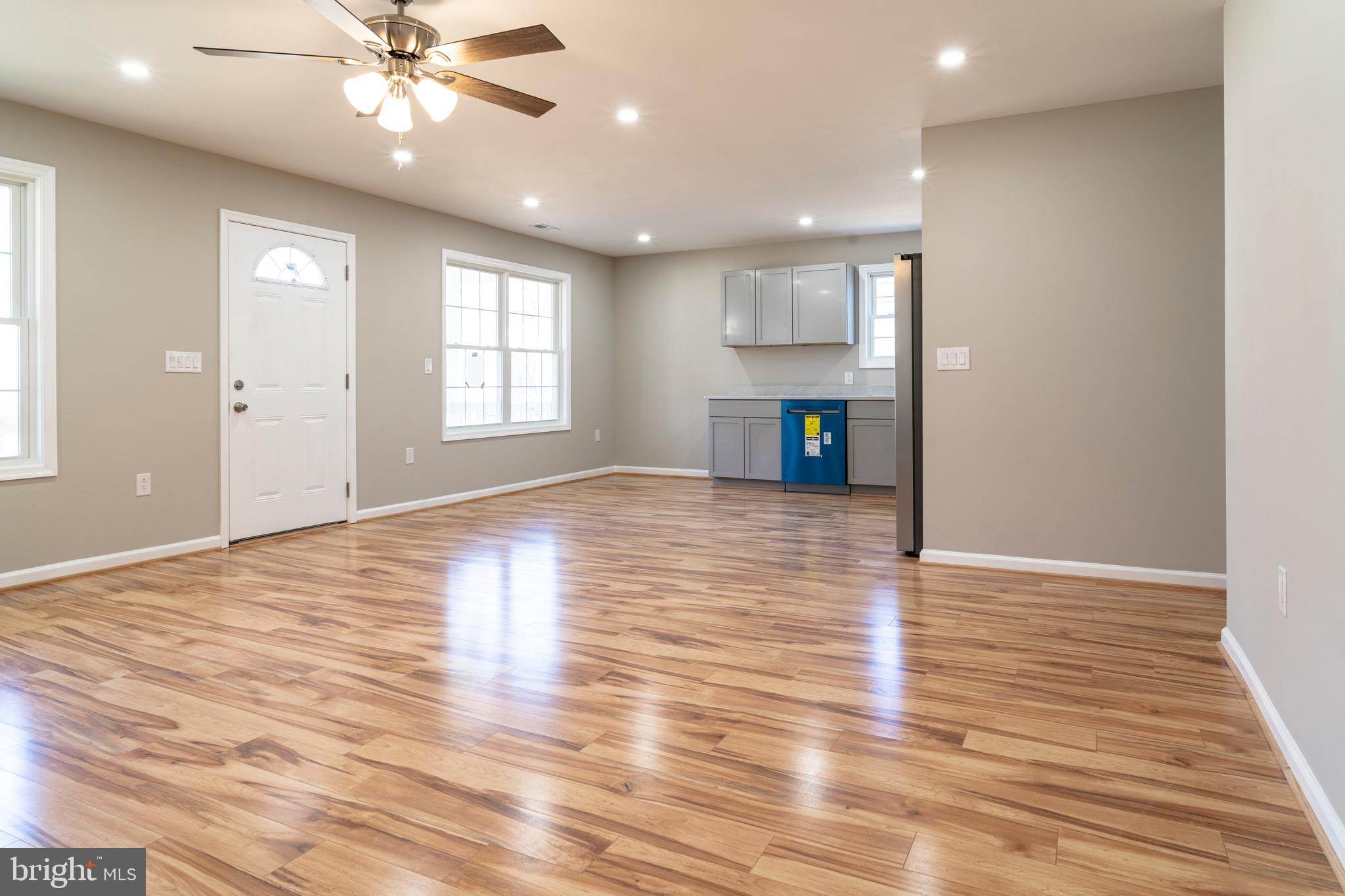 240 Deford Avenue Stanley, VA 22851 - Photo 11 of 60 a view of empty room with wooden floor and fan
