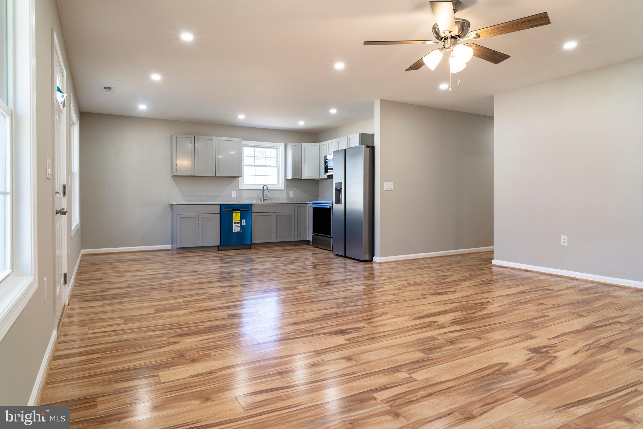 240 Deford Avenue Stanley, VA 22851 - Photo 15 of 60 a view of a kitchen with a sink and a refrigerator