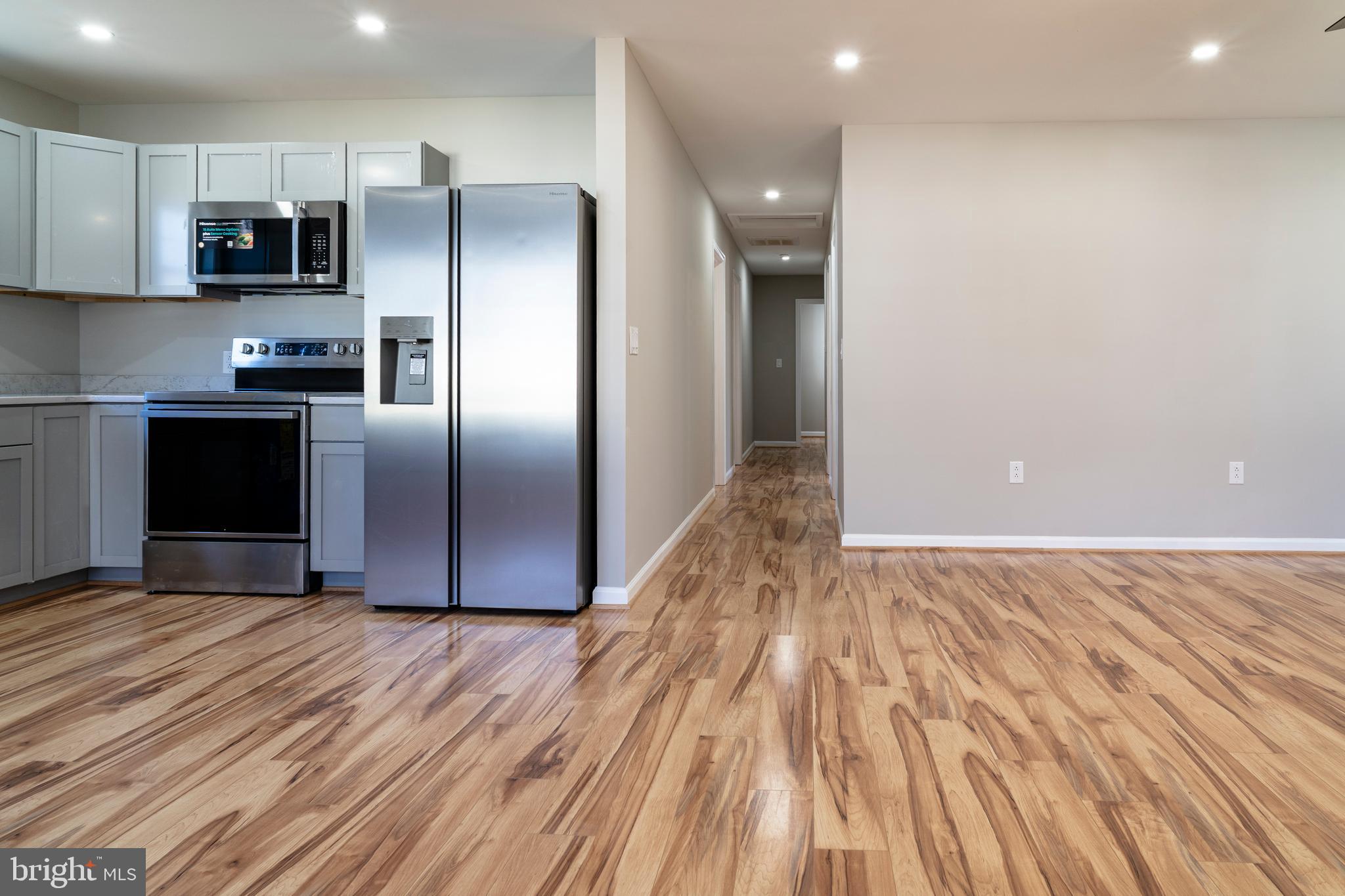240 Deford Avenue Stanley, VA 22851 - Photo 17 of 60 a kitchen with stainless steel appliances a refrigerator and a stove top oven
