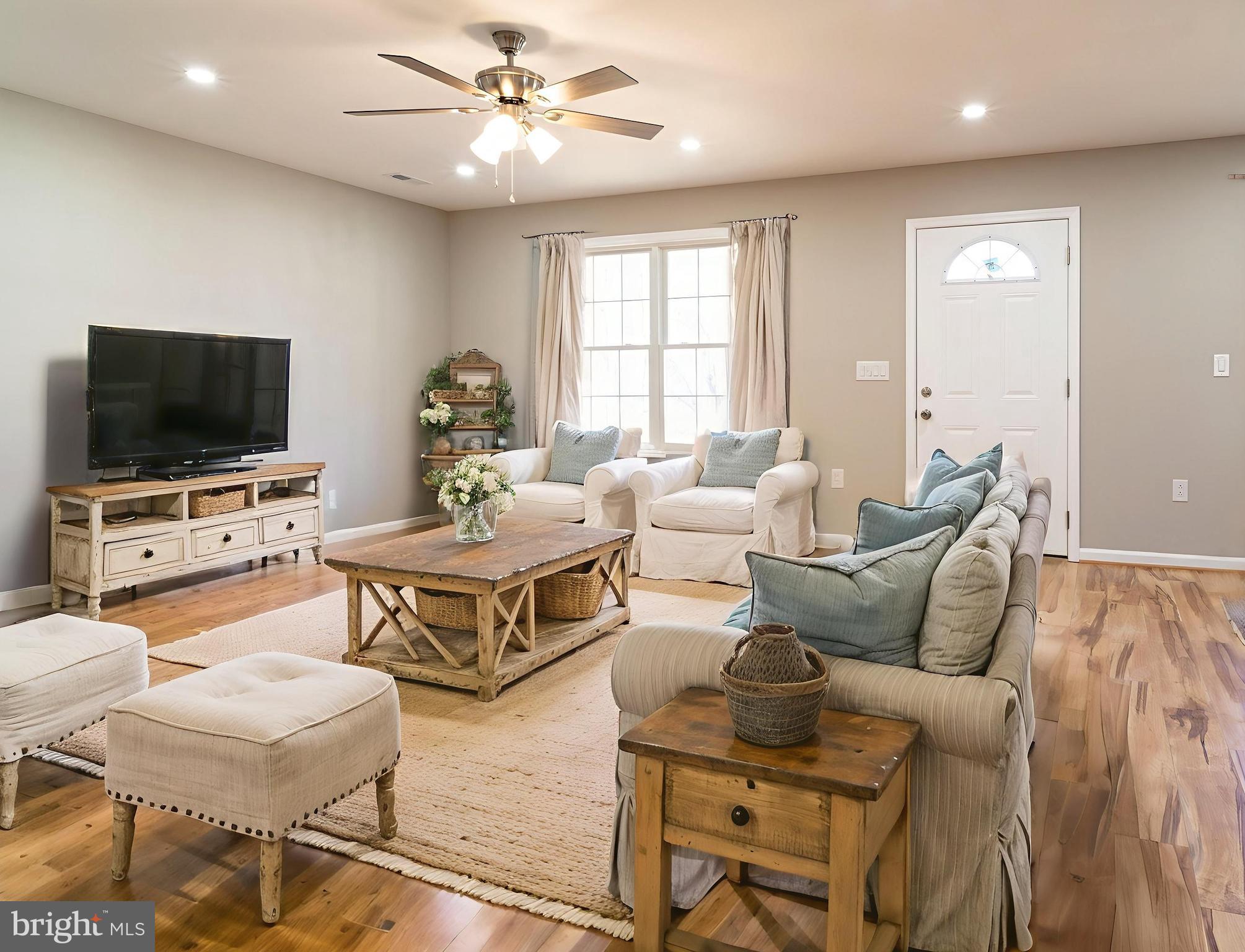 240 Deford Avenue Stanley, VA 22851 - Photo 21 of 60 a living room with furniture and a flat screen tv