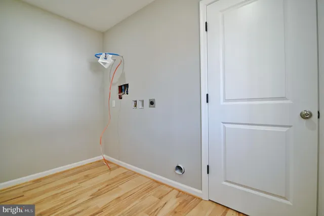 a view of a yard with wooden fence