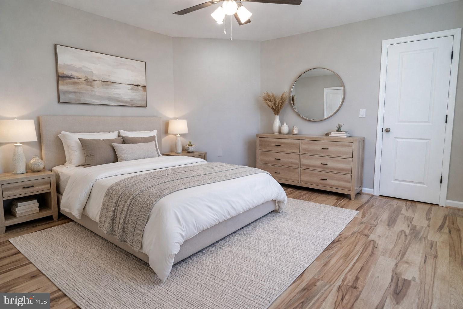 240 Deford Avenue Stanley, VA 22851 - Photo 25 of 60 a bedroom with a bed a mirror and lamp on table