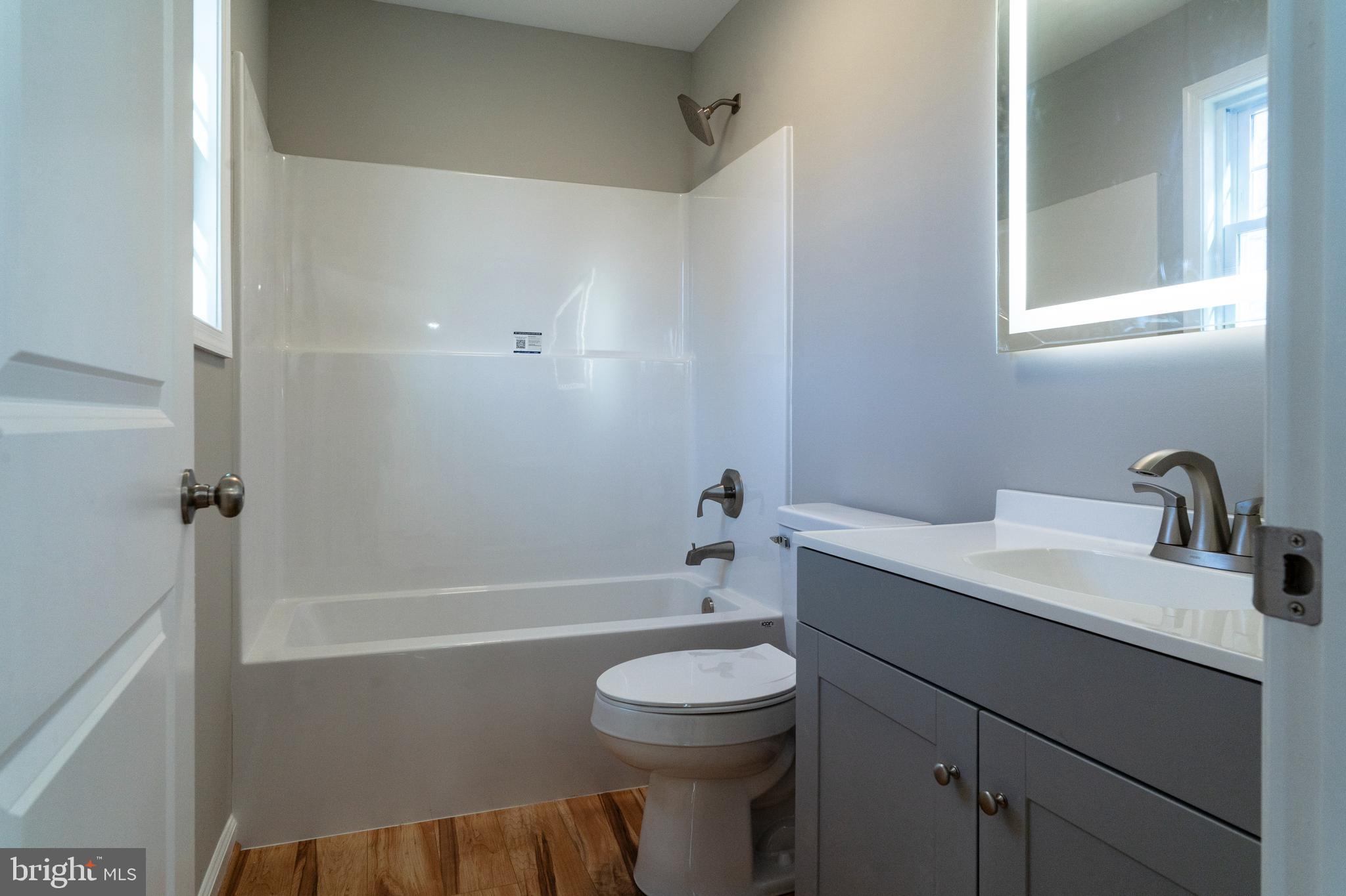 240 Deford Avenue Stanley, VA 22851 - Photo 27 of 60 a bathroom with a sink a toilet and shower