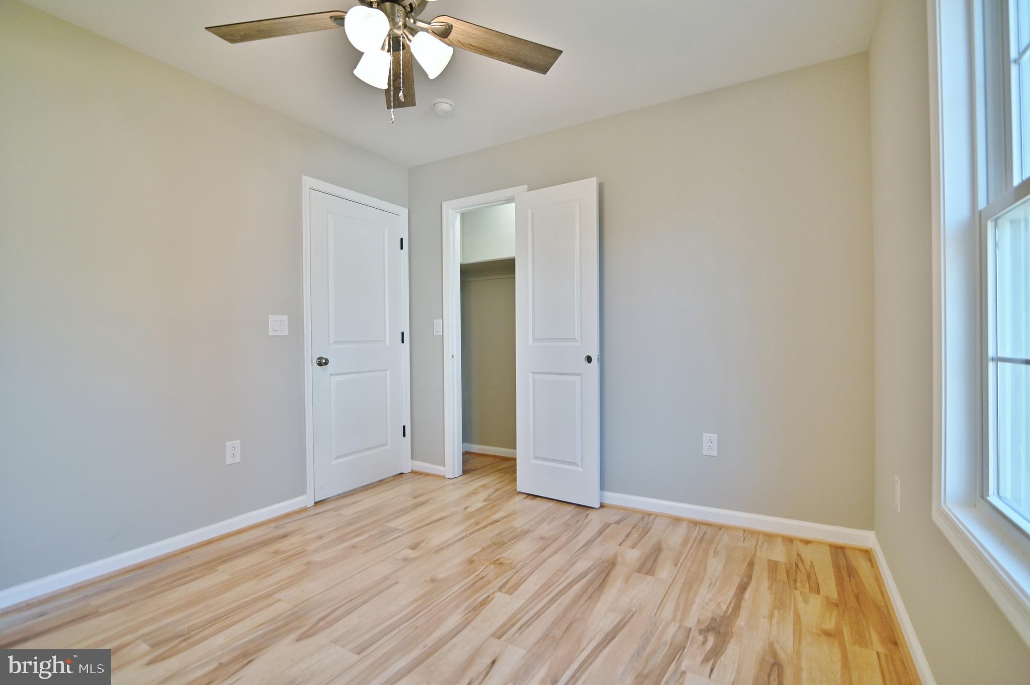 240 Deford Avenue Stanley, VA 22851 - Photo 31 of 60 wooden floor in an empty room with a window