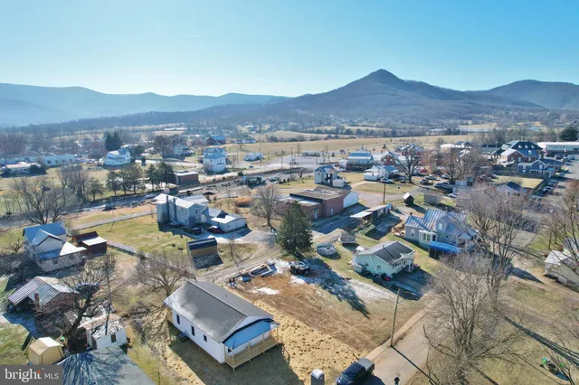 a view of a city with mountains in the background