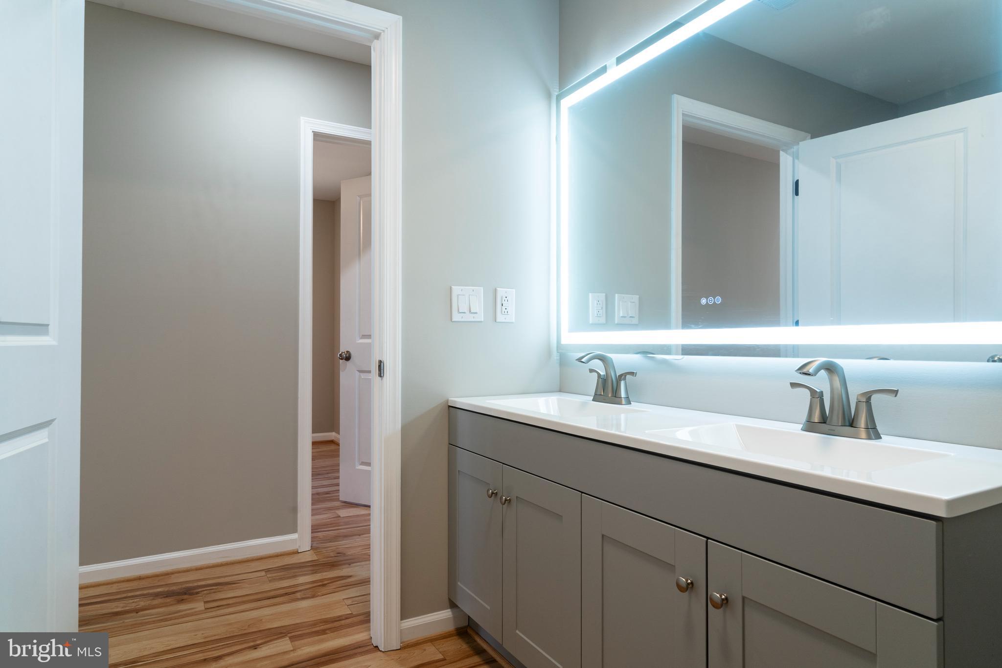 240 Deford Avenue Stanley, VA 22851 - Photo 41 of 60 a bathroom with a sink and a mirror