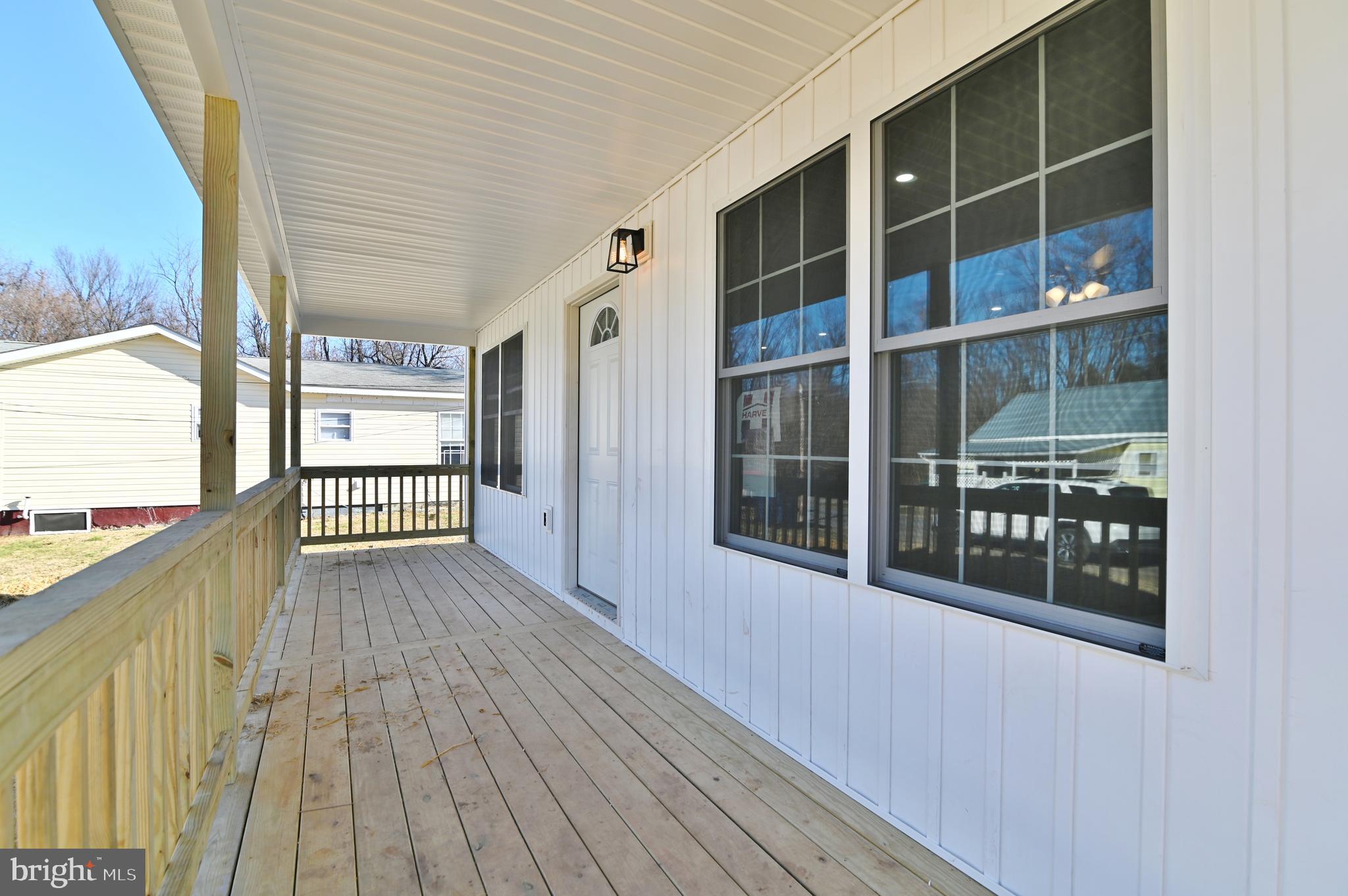 240 Deford Avenue Stanley, VA 22851 - Photo 5 of 60 a view of a balcony with wooden floor