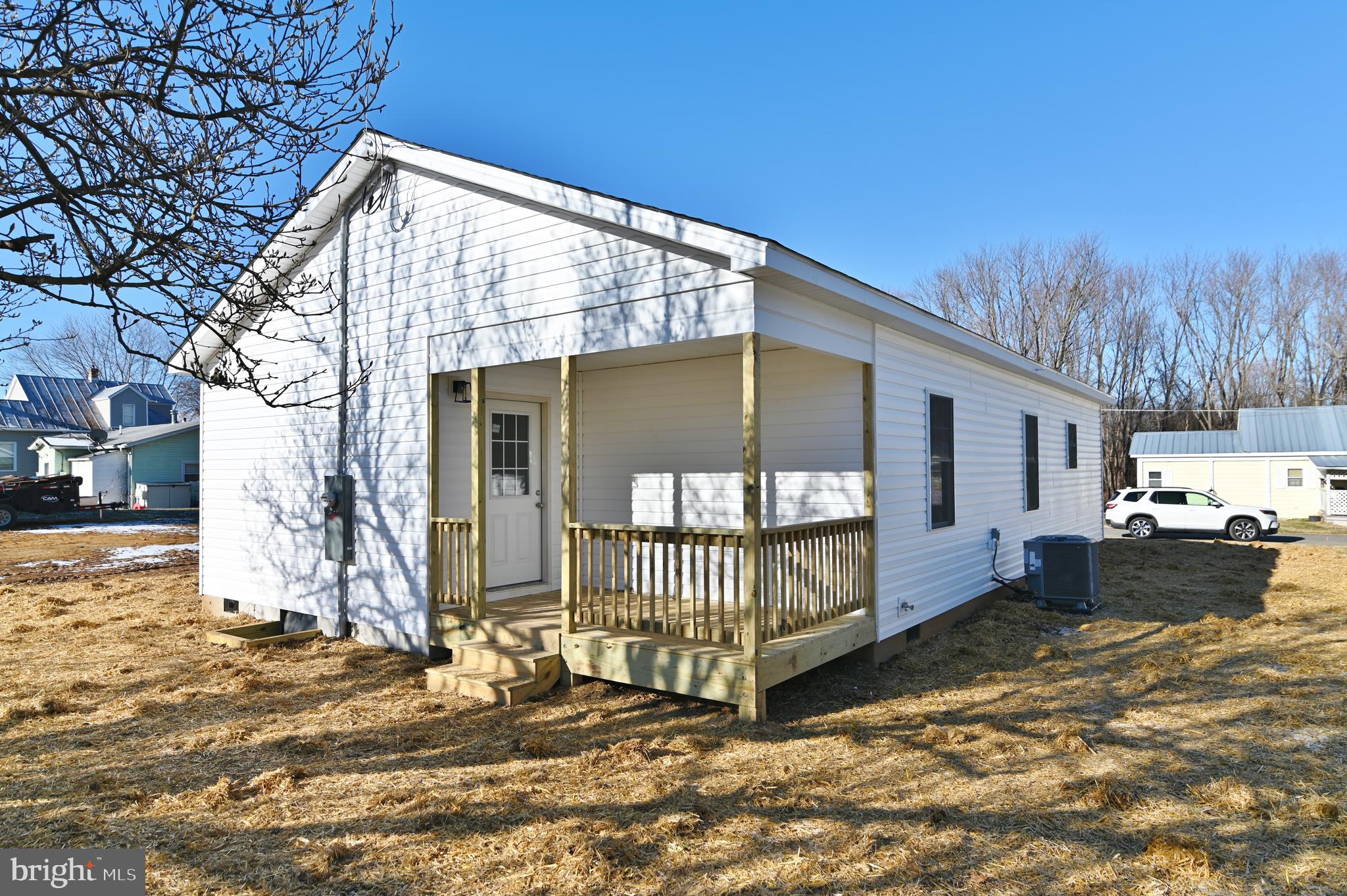 240 Deford Avenue Stanley, VA 22851 - Photo 55 of 60 a view of a house with a yard patio and wooden floor