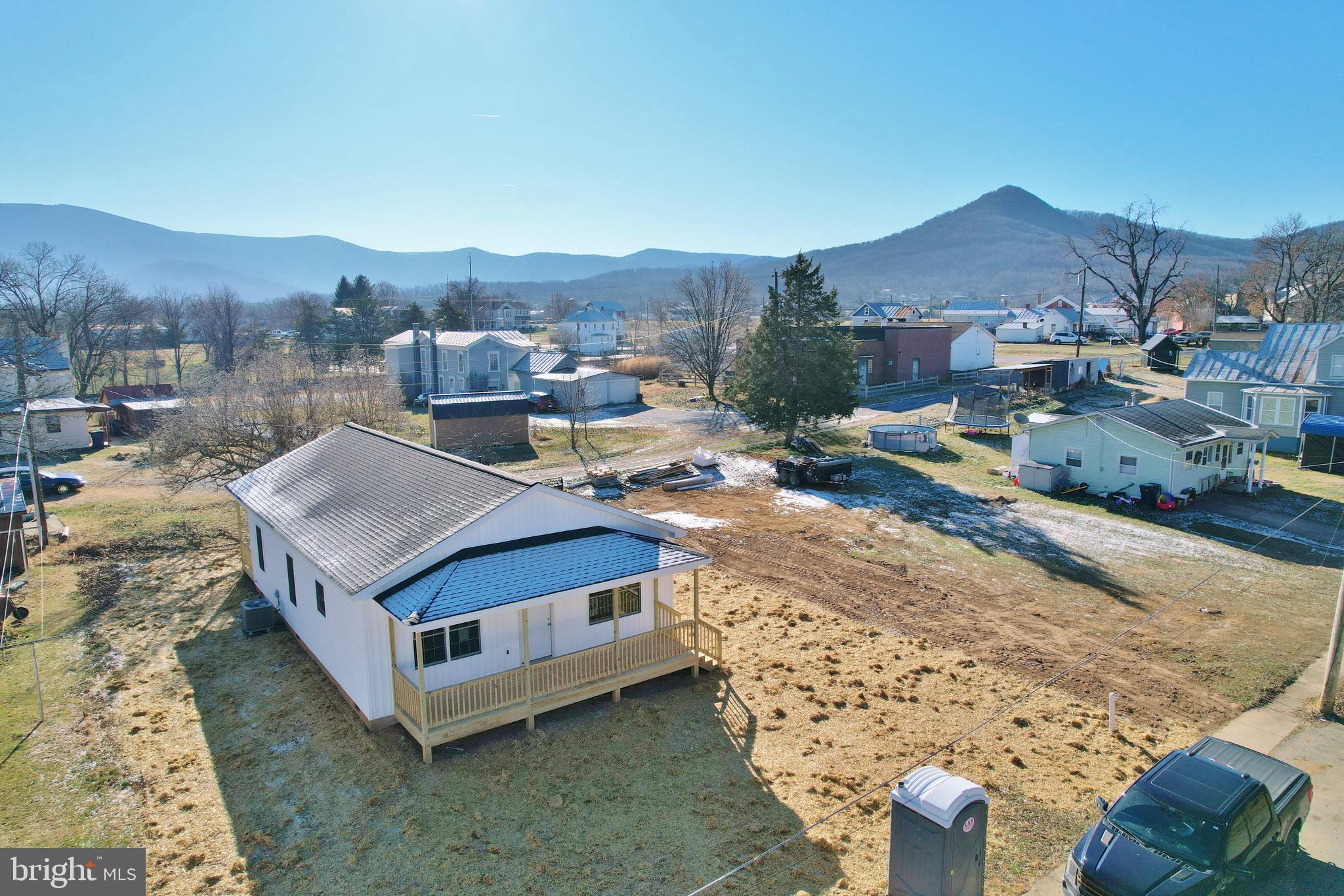 240 Deford Avenue Stanley, VA 22851 - Photo 57 of 60 a view of a house with a mountain in the background