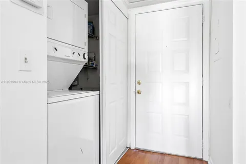 a view of storage and utility room with washer and dryer