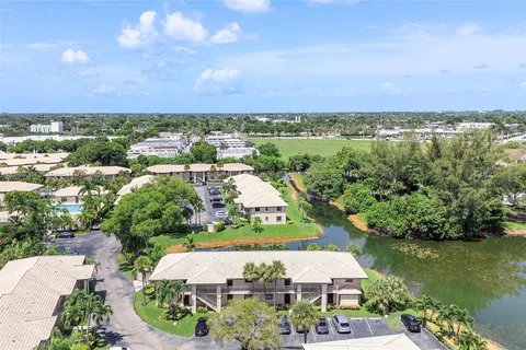 an aerial view of a house with a lake view