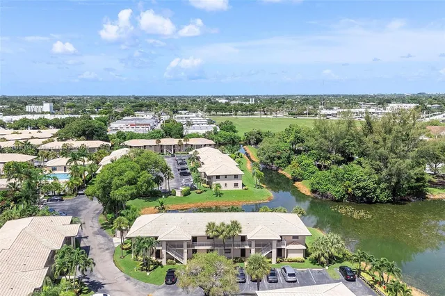 an aerial view of a house with a lake view