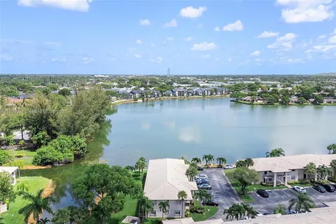 an aerial view of a house with a lake view