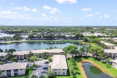 an aerial view of a house with a lake view