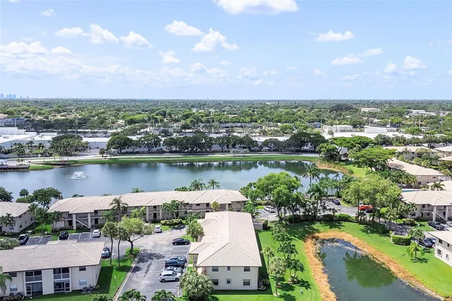 an aerial view of a house with a lake view