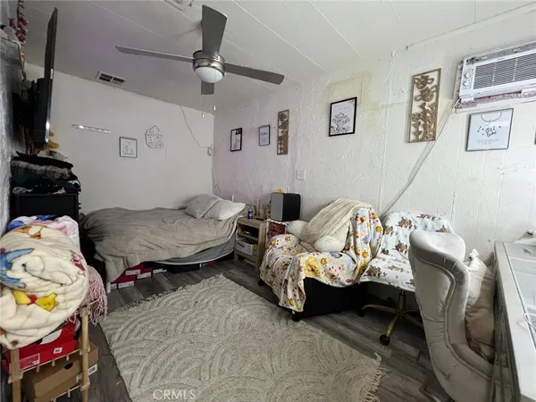 a bedroom with bed and a couch