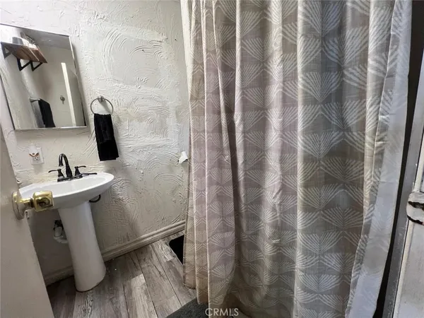 a bathroom with a sink and mirror