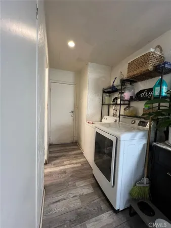 a kitchen with stainless steel appliances granite countertop a stove and a refrigerator
