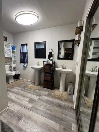 a room with a bed and a flat screen tv