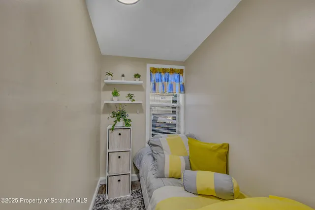 a living room with furniture and window