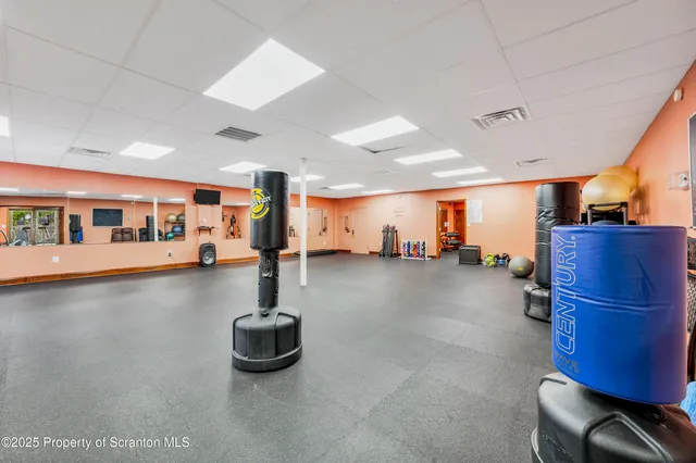 a lobby with furniture and a floor to ceiling window