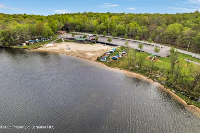 an aerial view of a house with outdoor space