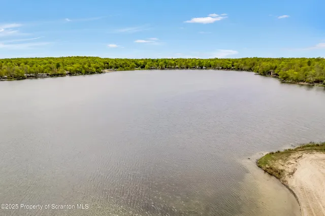 a view of a road with a fence
