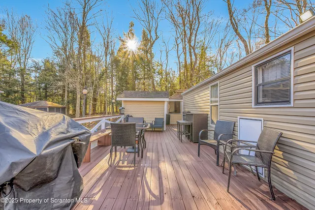 a view of a patio with table and chairs and couches