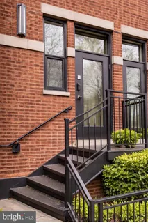 a view of a brick house with a large windows