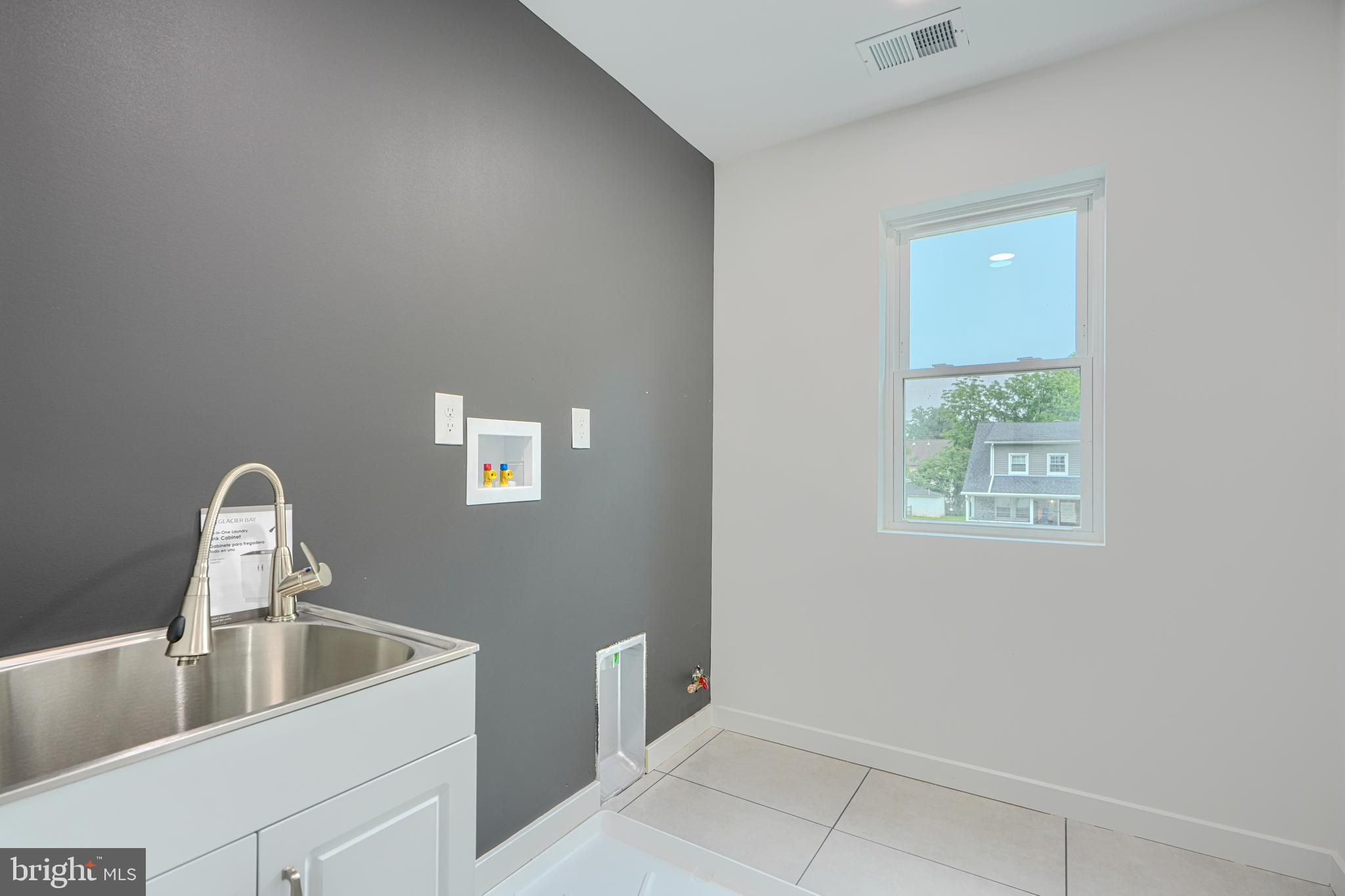 3410 Pinkney Road Baltimore, MD 21215 - Photo 34 of 55 a close view of sink and tap