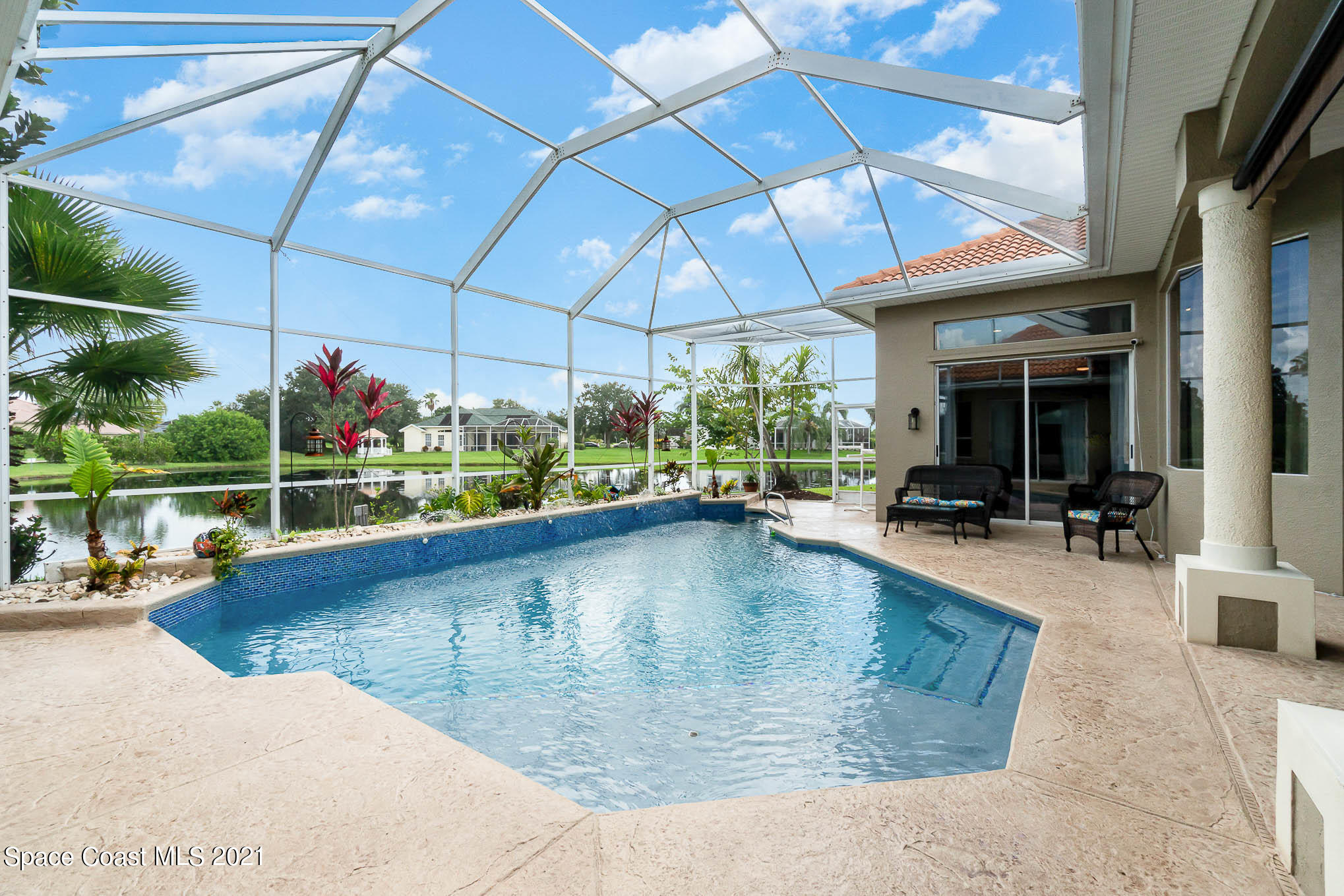 4150 Stoney Point Road Melbourne, FL 32940 - Photo 8 of 40 a view of a swimming pool with a patio