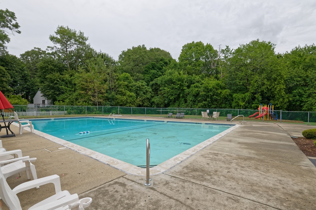 2 Universal Street, Unit 4 Framingham, MA 01702 - Photo 13 of 18 a view of a swimming pool with a yard