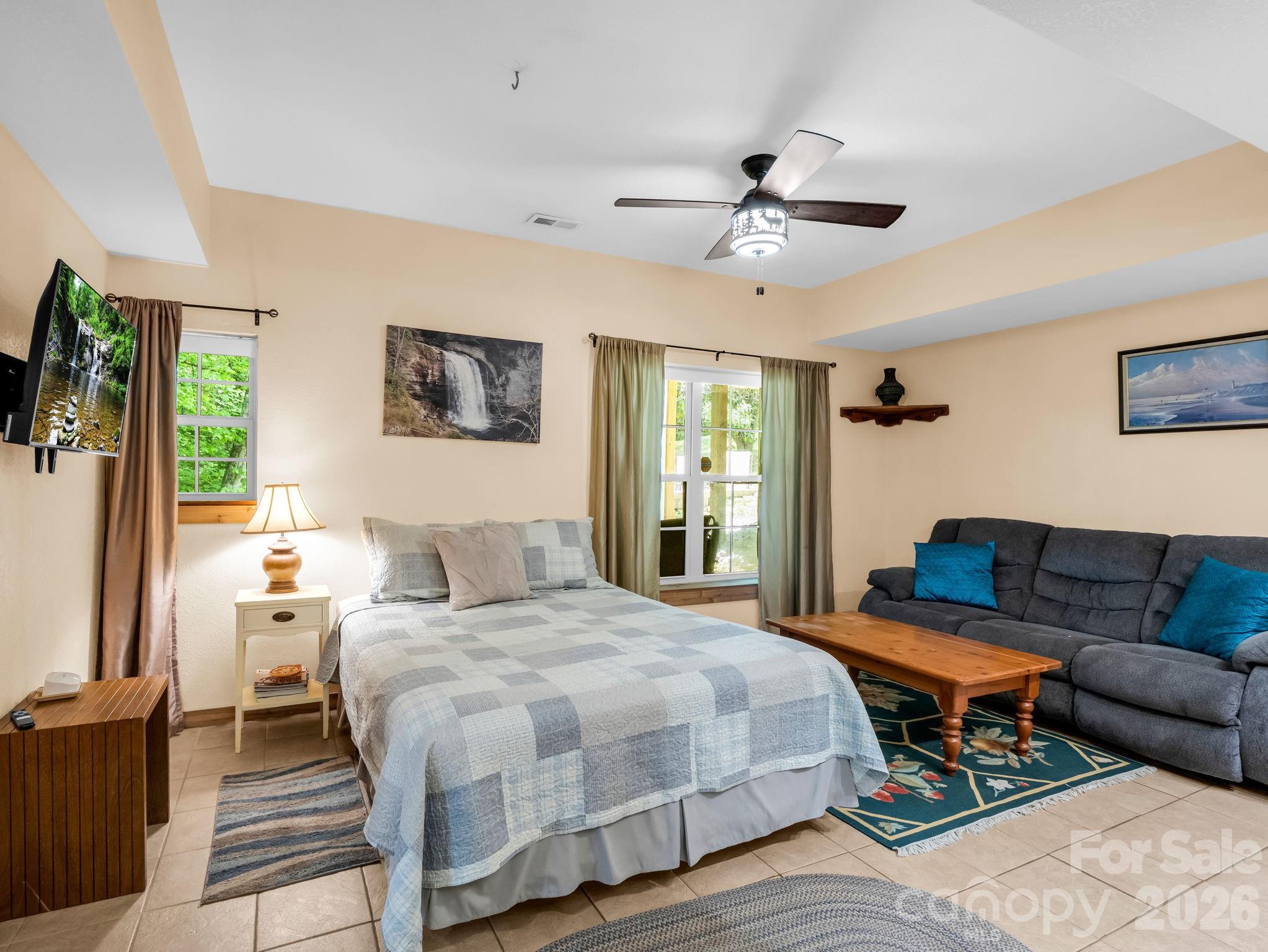 165 Dream Road Hendersonville, NC 28792 - Photo 25 of 46 a bedroom with a bed and wooden floor